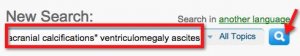 screenshot of UpToDate search page with terms entered in search box and arrow pointing to search button